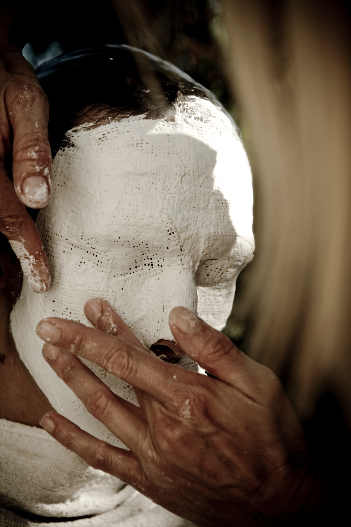 Making a plaster mask.